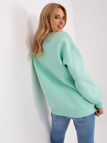 Hurt Miętowa dresowa bluza bez kaptura z napisem