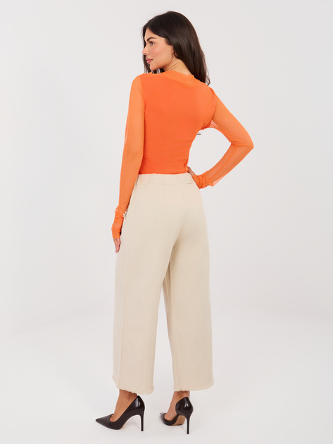 Jasnobeżowe szerokie jeansy z kieszeniami