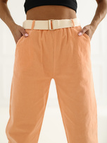 Jasnopomarańczowe sztruksowe spodnie z kieszeniami