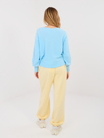 Pastellgelbe Jogginghose.