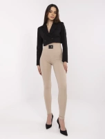 Beżowe damskie legginsy z ozdobną naszywką