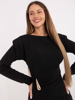 Black business blouse with shoulder pads.