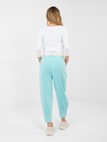 Miętowe dresowe spodnie z kieszeniami 