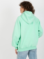Hurt Miętowa dresowa bluza oversize kangurka z napisami 