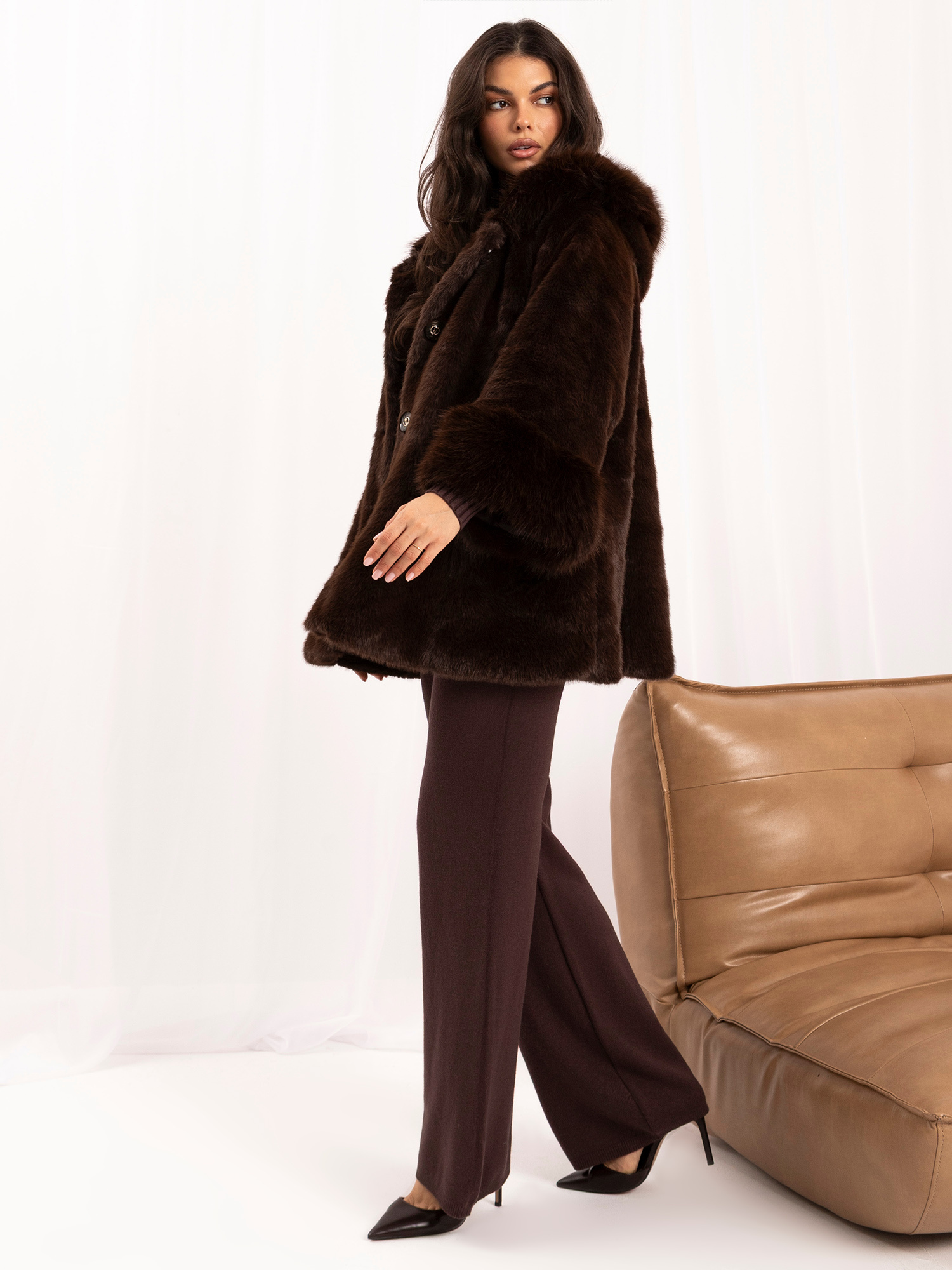Chocolate trapeze coat made of soft eco-fur.
