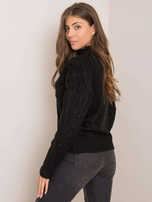 Der schwarze Pullover von Miguel.