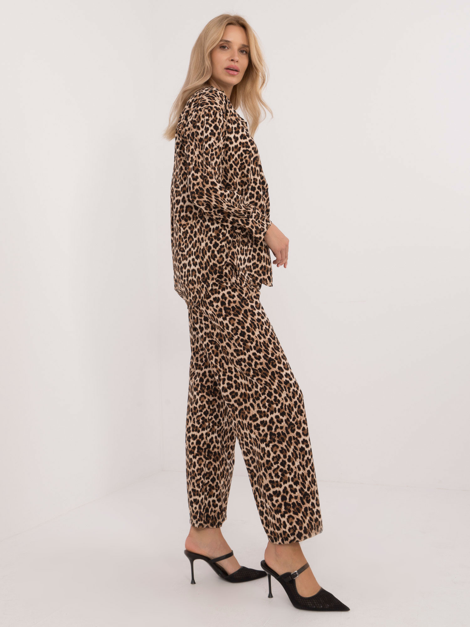 Beige-black two-piece set with leopard print pants.
