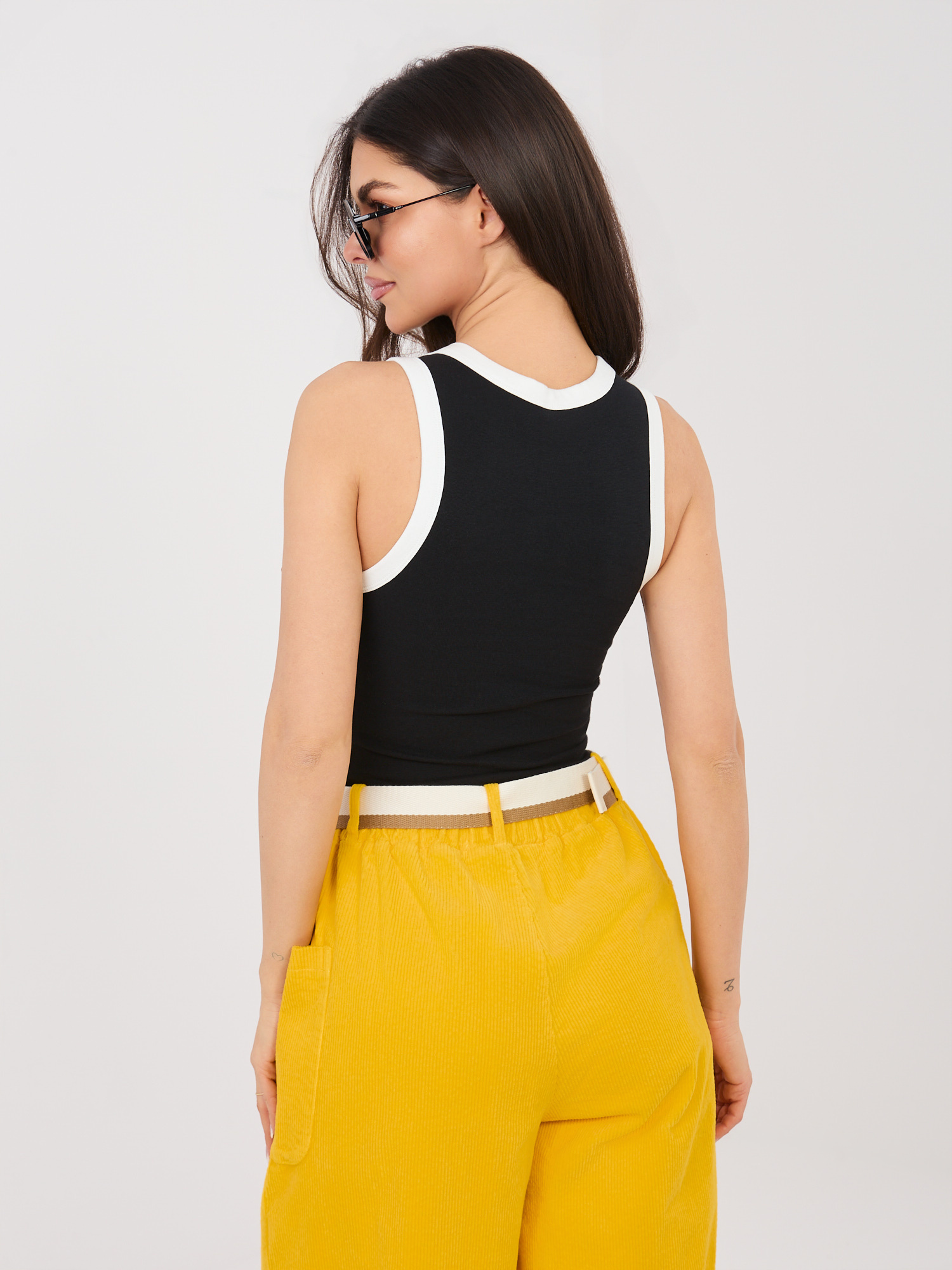 Black short sleeveless top SUBLEVEL.