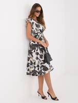 Black dress with frills at the sleeves.