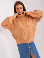 Hurt Brzoskwiniowy sweter oversize z warkoczami 