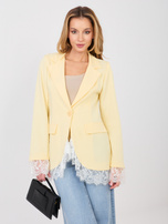 Pastelowa żółta elegancka marynarka z zapięciem na guzik
