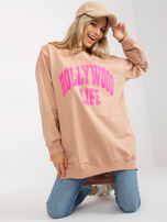 Hurtownia Beżowo-różowa długa bluza oversize z napisem