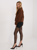 Schwarze elegante Leggings aus Spitze.