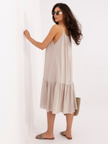 Beige flared dress with a ruffle.