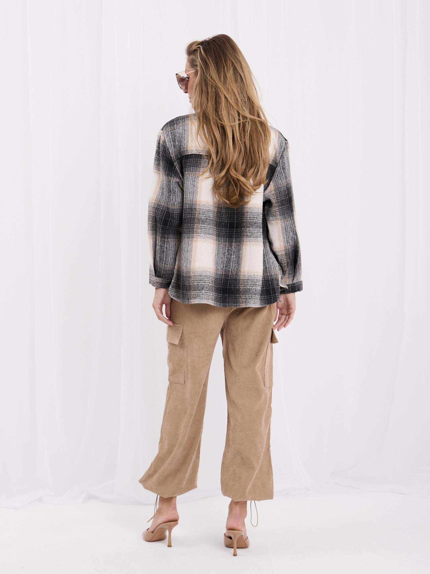 Camel corduroy cargo pants with a waist tie.