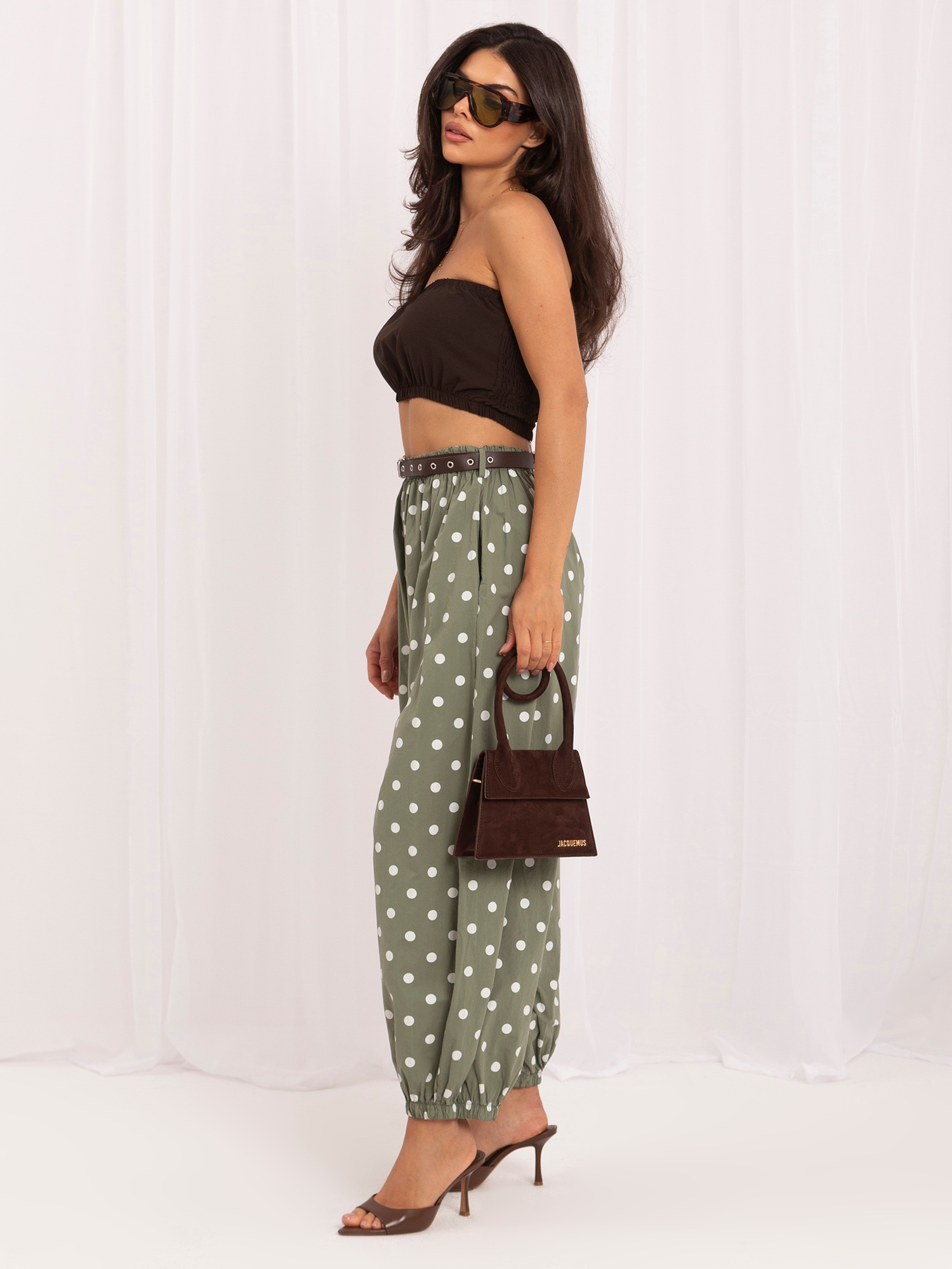 Khaki cotton pants with polka dots.