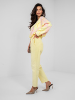 Pastelowe żółte sztruksowe spodnie z kieszeniami 