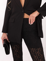 Black lace pants without a fastening.