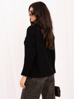 Black women's oversized turtleneck sweater.