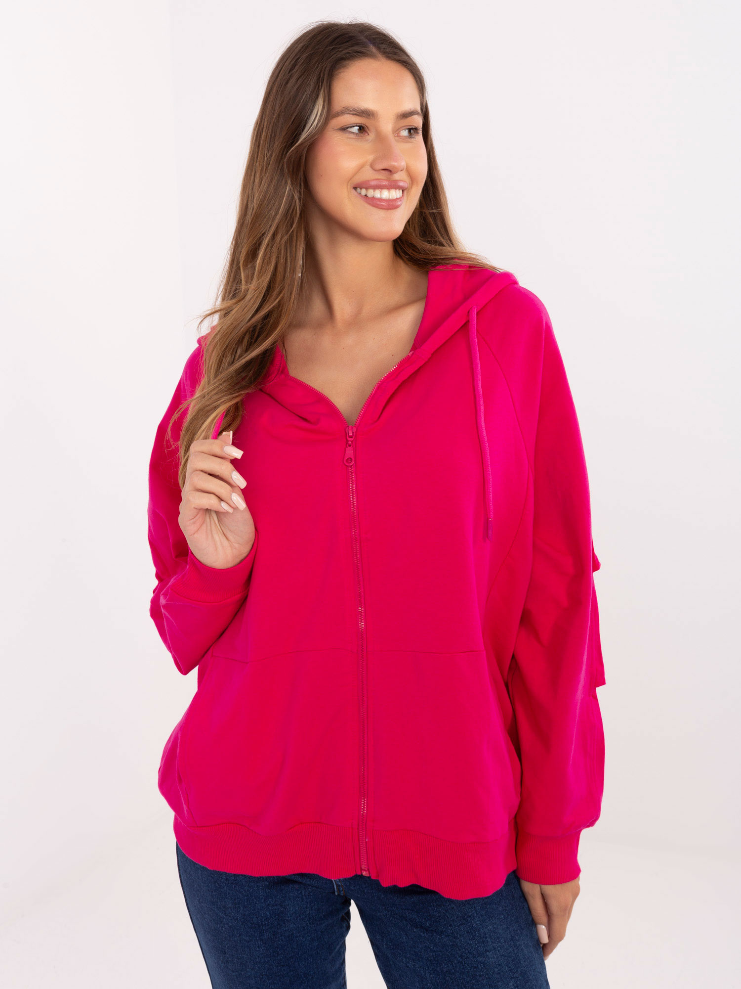 Fuchsia zip-up oversized sweatshirt with pockets.