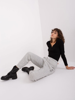 Light gray sweatpants with SUBLEVEL print.