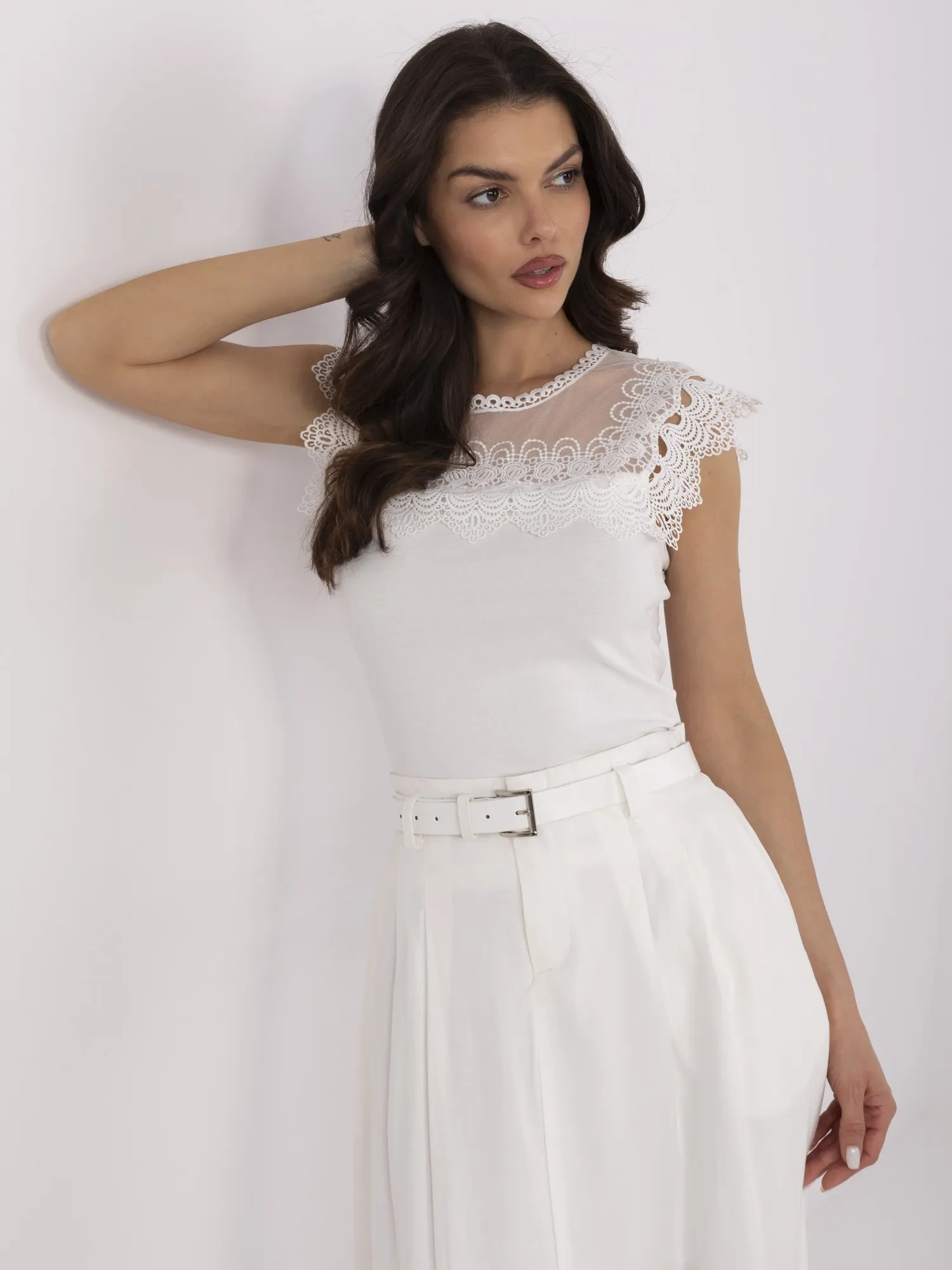 White fitted blouse with lace.