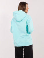 Miętowa dresowa bluza oversize z napisem RUE PARIS 