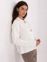 Ecru button-up sweater with golden buttons.