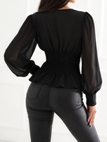 Black fitted blouse with Chinese fastenings.