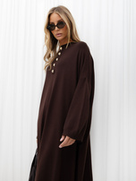 Oversized chocolate knitted dress with decorative buttons.