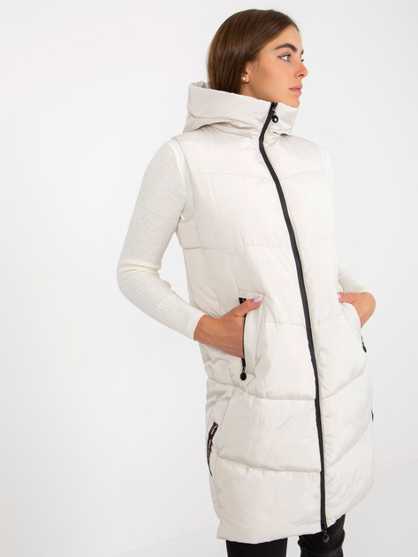 Hurtownia Kremowa długa kamizelka puchowa z kapturem