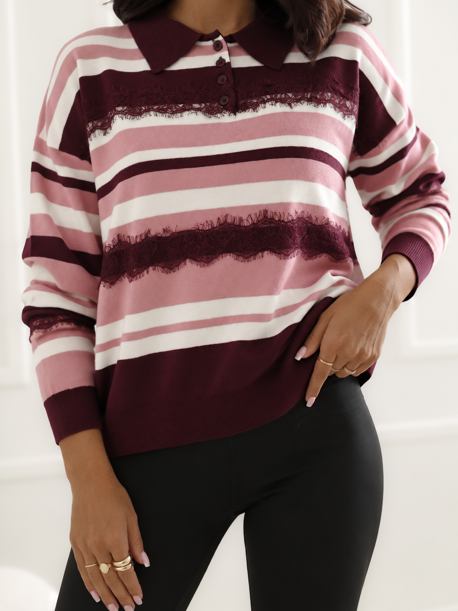 Pink women's striped polo sweater.