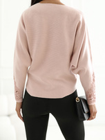 Light pink women's sweater with lace.
