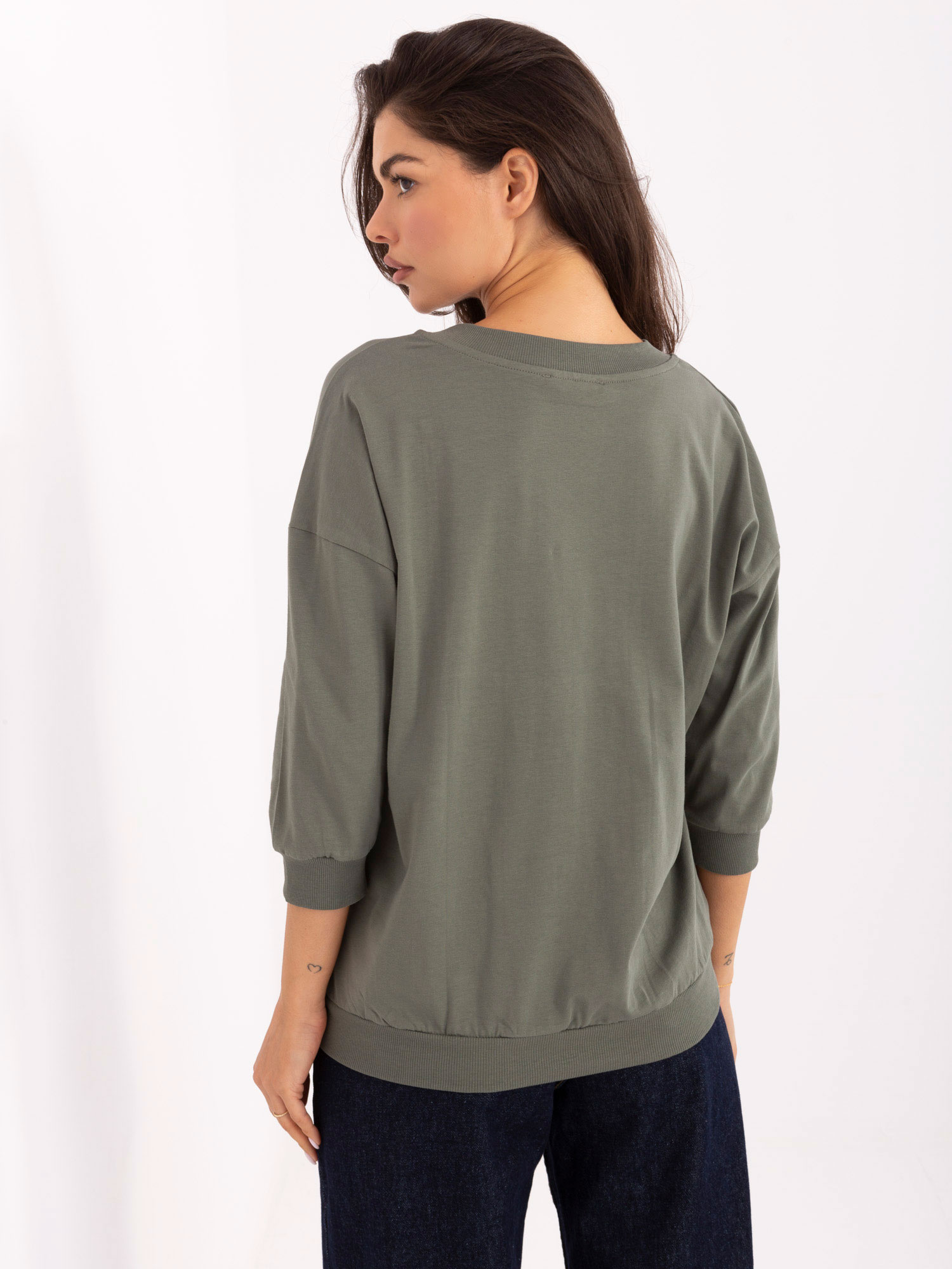 Khaki cotton blouse with a V-neck.