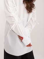 Hurt white long shirt with cuffs on the sleeves.