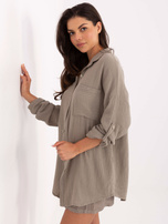 Dark beige button-up muslin shirt.