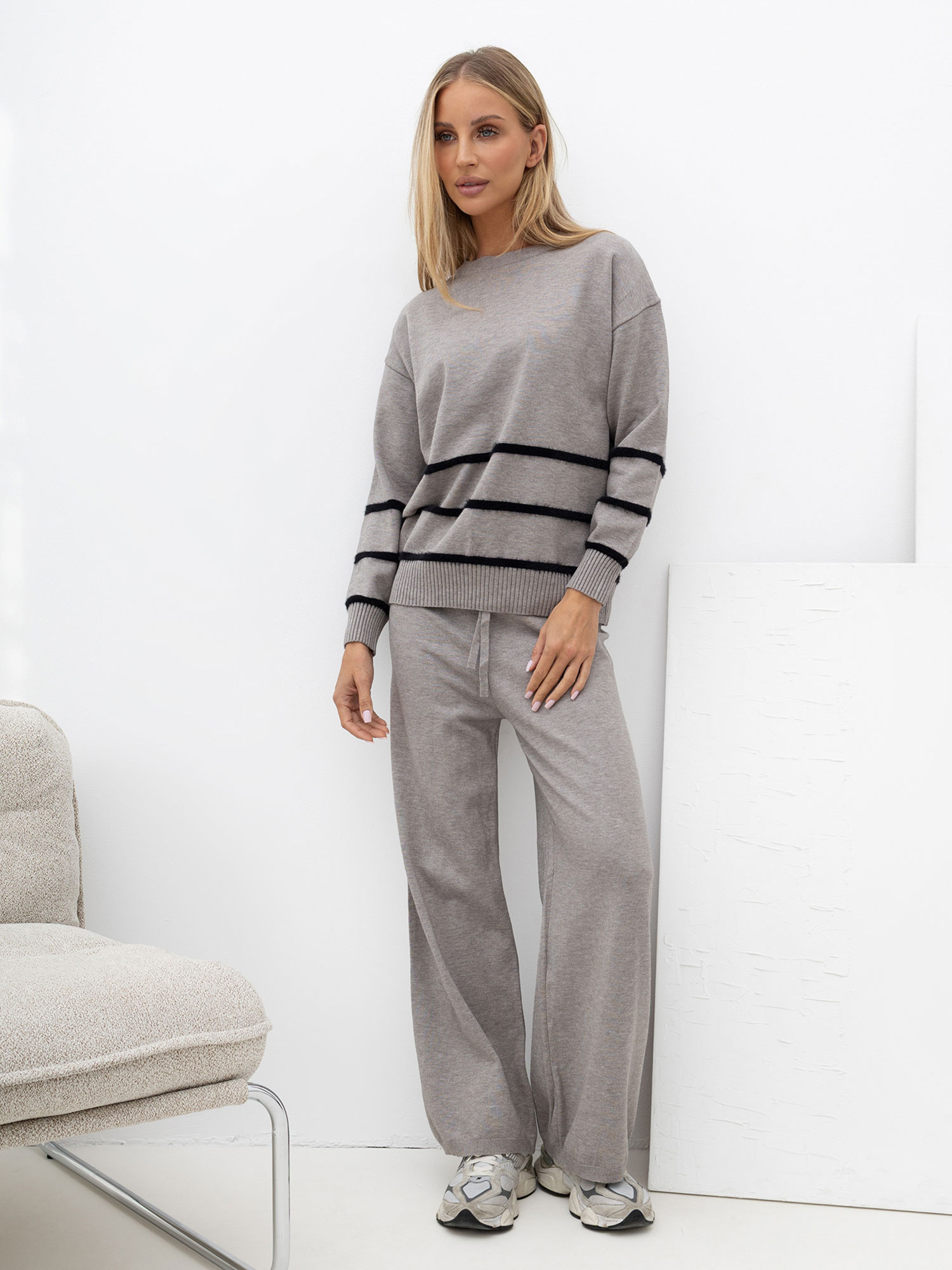 Gray knit set with wide pants.