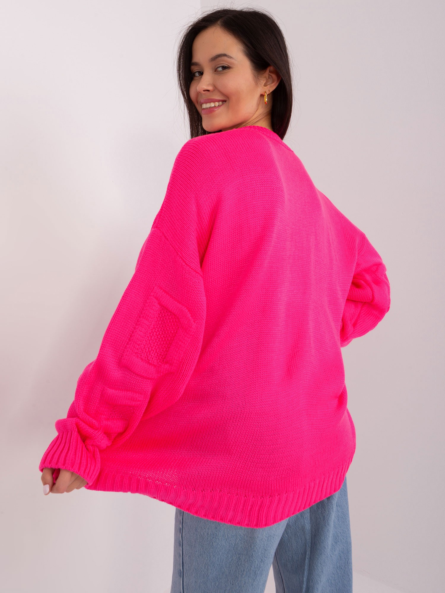 Wholesale Fluo pink oversized sweater with a round neckline.