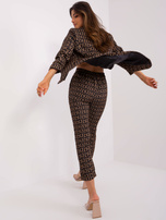 Hurt Czarno-camelowe materiałowe spodnie w napisy