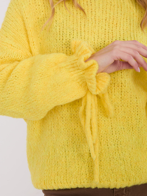 Źółty sweter z wiązaniami przy rękawach