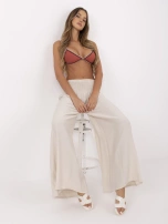 Beige summer pants with a wide elastic band.