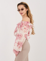 Pink elegant off-the-shoulder blouse with flowers.