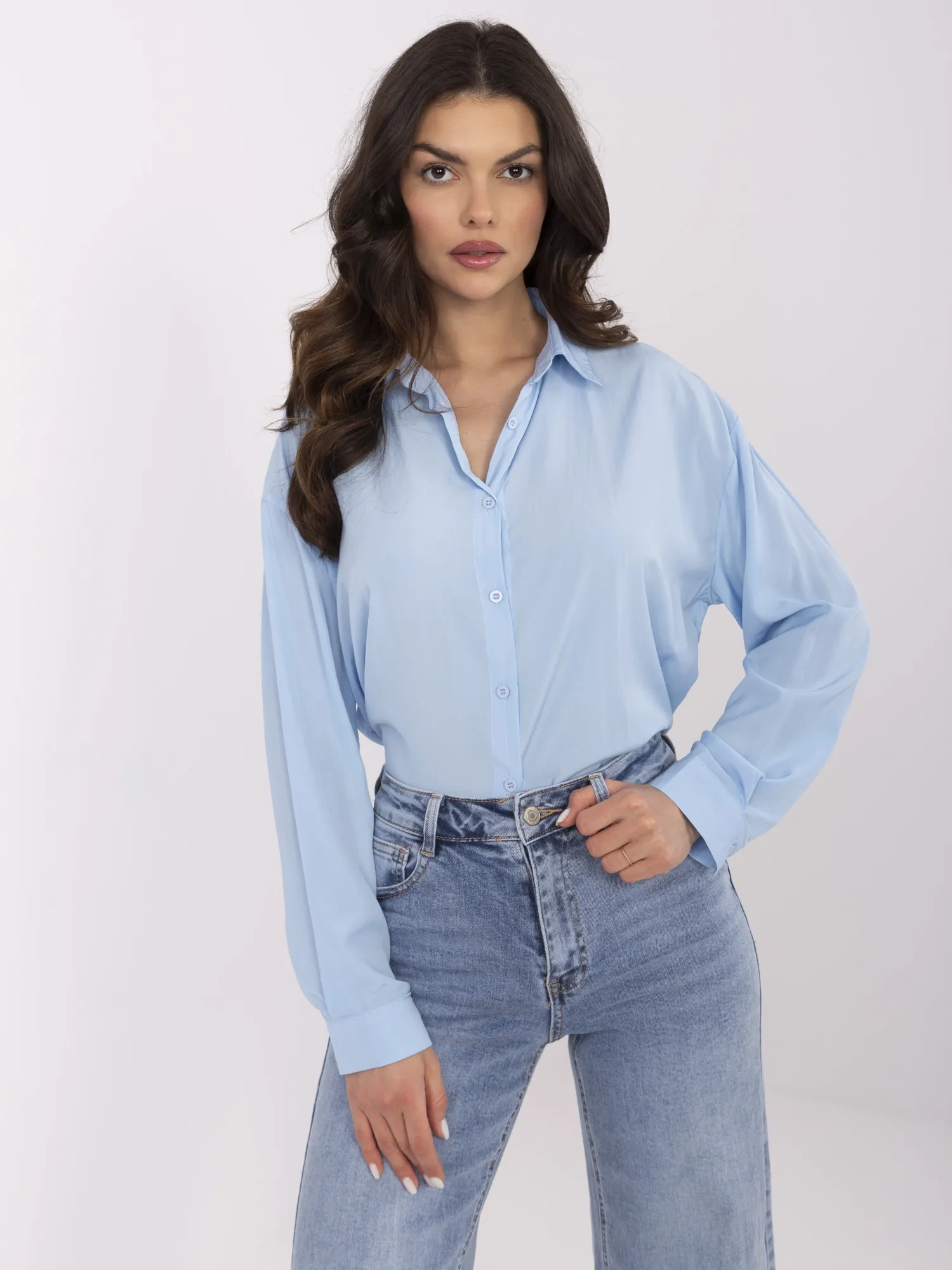 Light blue button-up shirt with a collar.