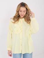 Light yellow shirt with 3D floral applique.