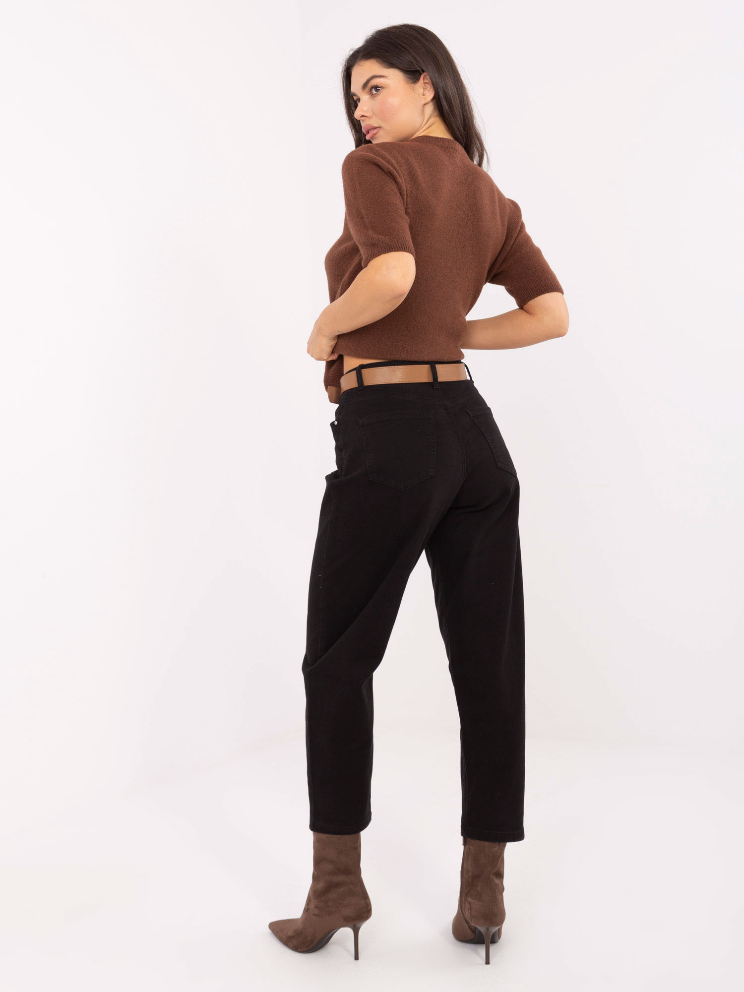 Black women's mom jeans with a belt.