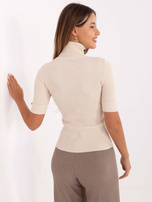 Light beige fitted ribbed sweater.