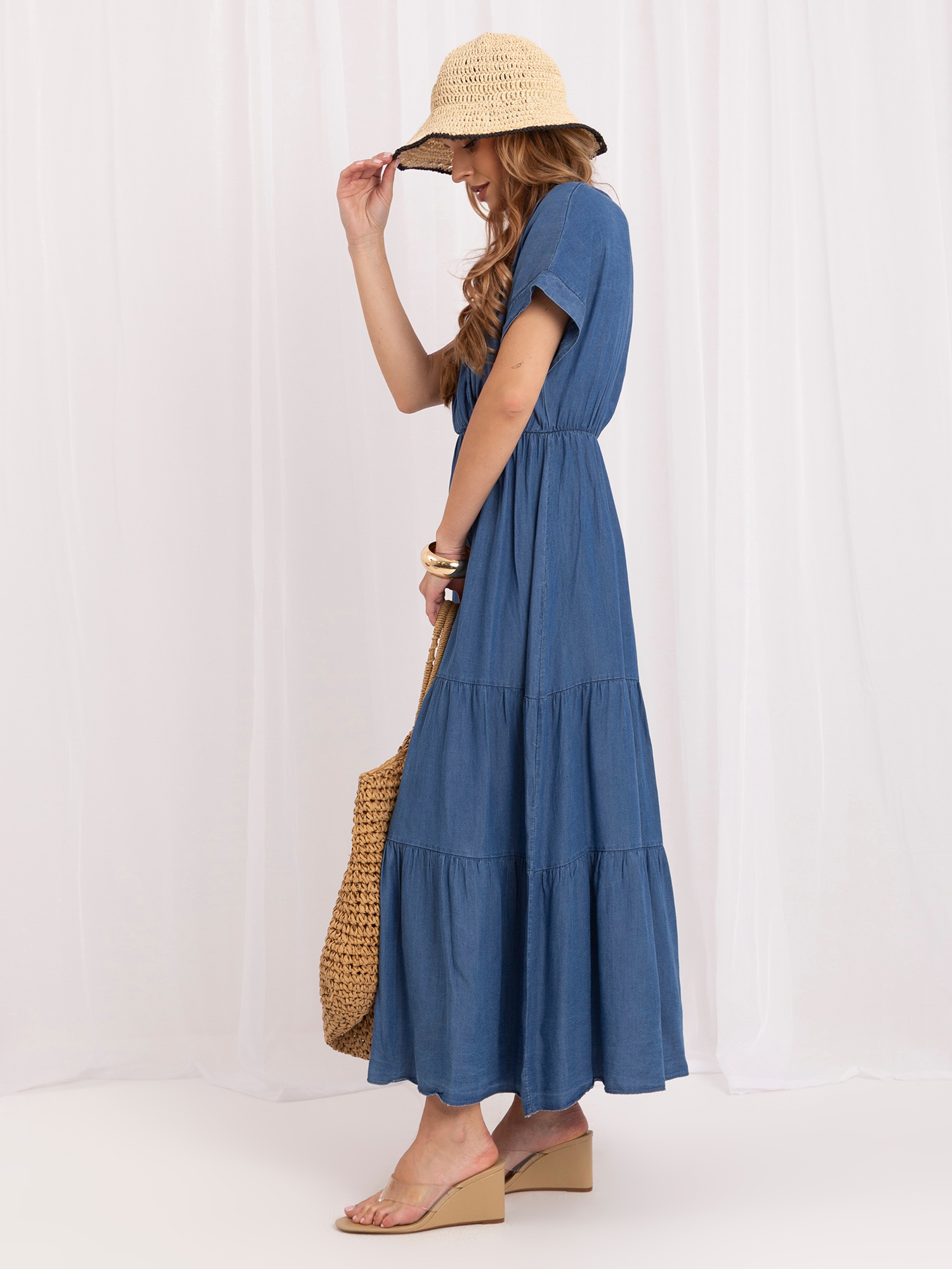 Dark blue summer dress with a ruffle.