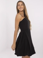 Black cocktail dress with pleats.