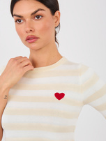 Jasnobeżowy damski sweter w paski