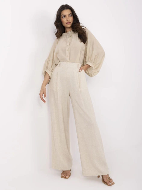 Beżowe letnie spodnie z szeroką nogawką